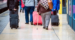 graphicstock travellers walk through train station carrying suitcases Bdeesy7HfW