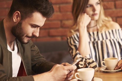 storyblocks man using cell phone over meeting with girlfriend SwMzhWF5M